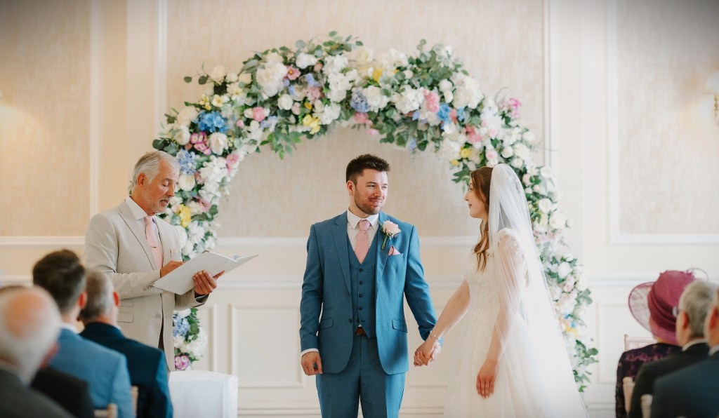 The Wedding Celebration Ceremony  immediately following the Sussex Registrars - Civil Celebrant Sussex officiating bespoke ceremony including Unity Candle symbolic action. Grand Hotel Eastbourne.